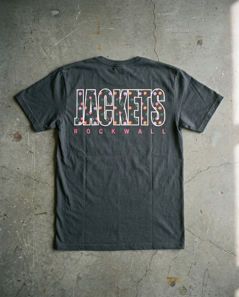 Rockwall Dizzy Floral tee in charcoal, back view with full width outline JACKETS filled with small flowers over ROCKWALL in pink