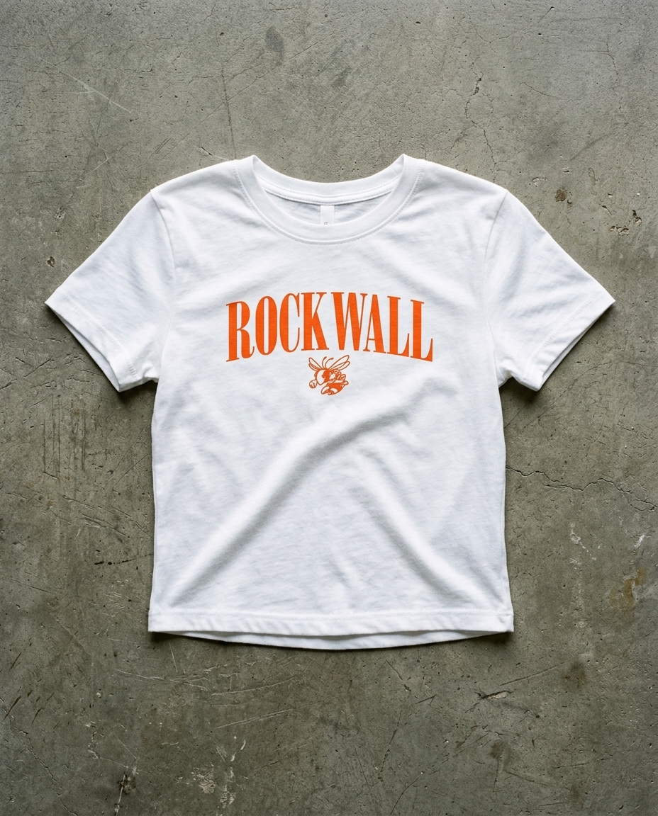 Rockwall Eras crop tee in white, orange serif ROCKWALL with the hornet mascot underneath on a cropped ribbed body