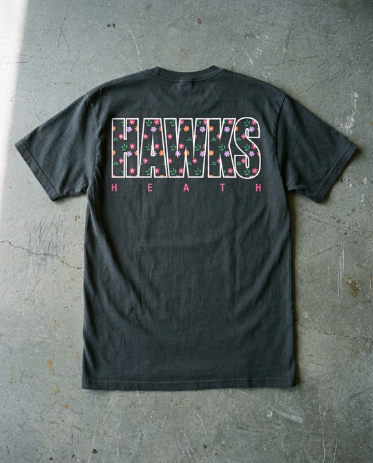 Heath Dizzy Floral tee in charcoal, back view with full width outline HAWKS filled with small flowers over HEATH in pink