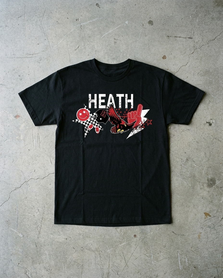 Heath Spirit Collage tee in black, HEATH over a collage of a red smiley, checkerboard panel, footballs, helmet, diving hawk, play marks, foam finger and lightning burst